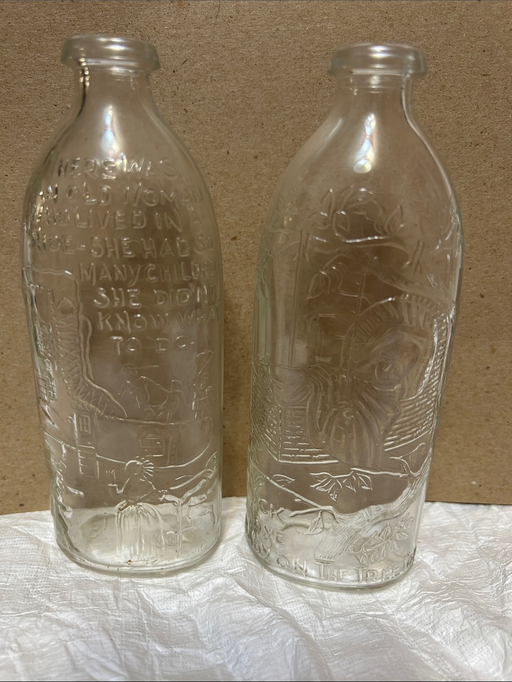 Antique 8 oz Embossed Clear Glass Baby Bottle Pair — Nursery Rhyme Decoration
